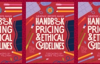 red cover book with writing on it with pencils and other artsy things